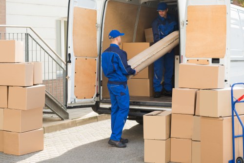 Boxes and furniture being loaded into storage in Romford