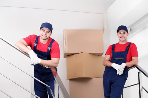 Professional movers handling office furniture in Romford