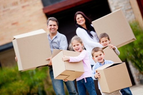 Local removal team handling furniture during a Romford home move
