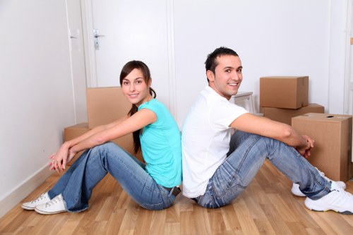 Romford removals team carefully loading furniture into a moving vehicle